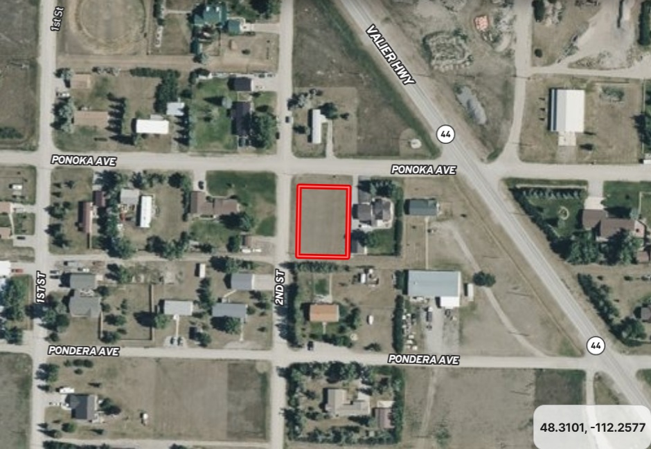 A satellite view map with a red rectangle indicating a property